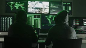 Hackers breaking server security using multiple computer monitors and surveillance camera footage - Powered by Shutterstock - Get 15% off with code: PIKWIZARD15