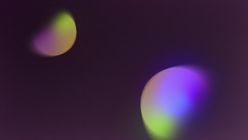 Glowing spheres interact, colliding and recoiling with shifting light and energy. Captivating atomic collision visuals ideal for cinematic backdrops and titles. Designed for all aspect ratios