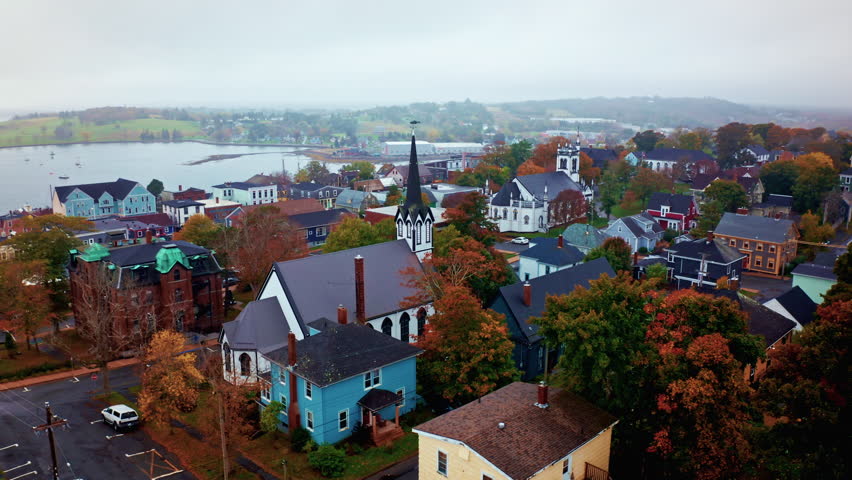 Aerial drone shot over the local town of Lunenburg in Nova Scotia, Canada. Fishing lobster town. Foggy misty day.
