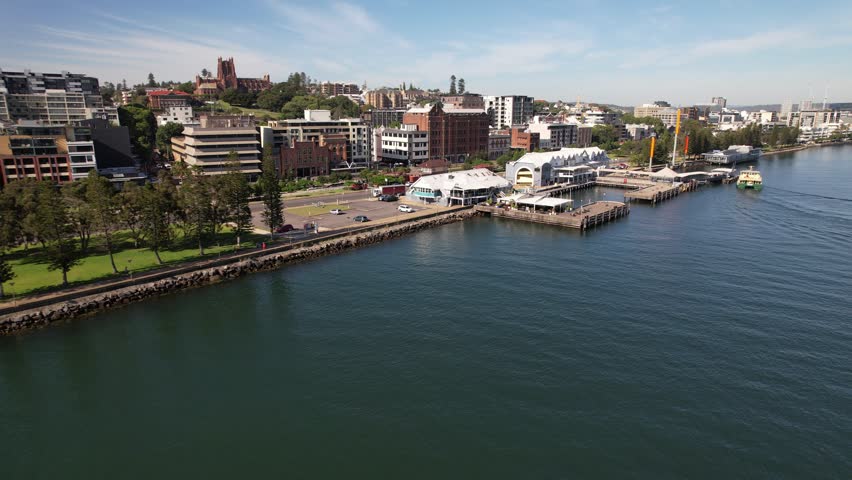 Ferry Terminal And Hotel On Hunter River In Newcastle, NSW, Australia. aerial shot