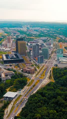 Vertical video. Luxembourg City, Luxembourg. View of the Kirchberg area with modern houses, Aerial View, Point of interest. Rich colors
