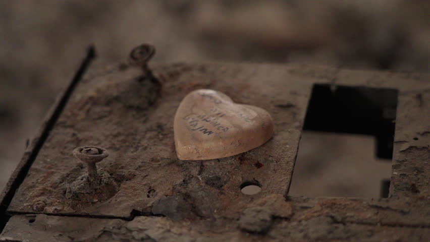 Close up of a stone shaped like a heart inside destroyed room in Kibbutz Nir Oz