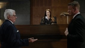 Courtroom modern lawyers in an american trial court in front of a judge - Powered by Shutterstock - Get 15% off with code: PIKWIZARD15