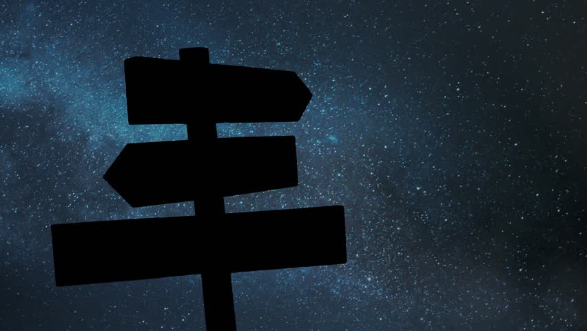 Signpost Multi Directional Against Night Sky, Time Lapse with Stars and Milky Way in Background, representing choices and directions in decision making