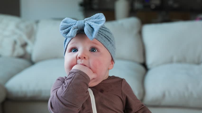 Adorable Cute Baby Girl with Blue Eyes Smiling and Laughing