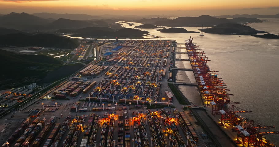 Aerial view of a busy container port at dusk in Ningbo, China.