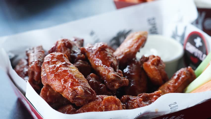 Sweet Barbeque Chicken Wings Served At The Restaurant. - closeup shot