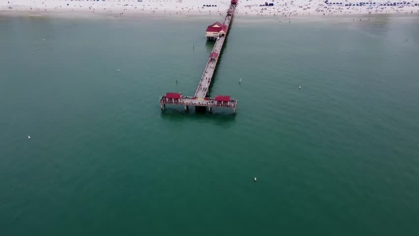 Pier 60 at Clearwater Beach, Florida, United States. Top-down drone shot showing the pier