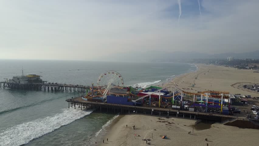 This footage captures the golden sands, rolling waves, and the lively atmosphere of this famous California landmark from a unique perspective. 