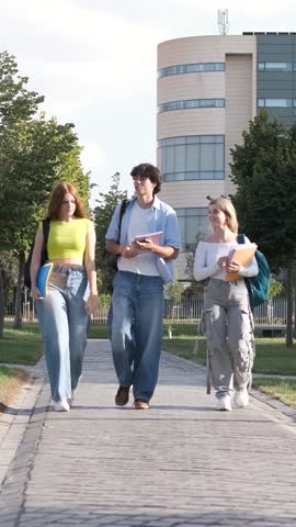 Engaging students walking and conversing together on a vibrant college campus