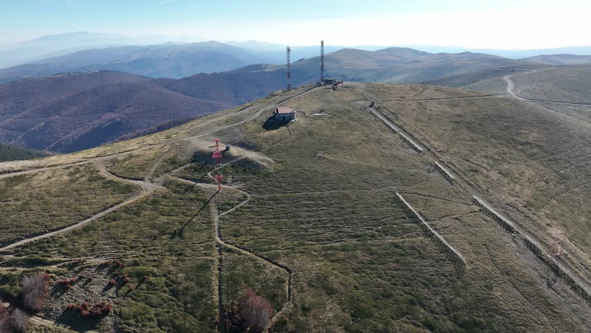 Frontal tracking shot of small cable car, communication antennas and Shelter on Mount Vermio. Greece.