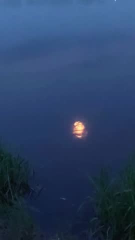 Beautiful Reflection of the moon in the sea. Full moon at night reflected in the water.