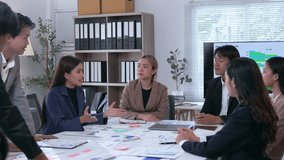 Professional Asian businesswomen sealing partnership agreement, shaking hands while colleagues clapping and celebrating successful business collaboration in modern corporate office environment - Powered by Shutterstock - Get 15% off with code: PIKWIZARD15