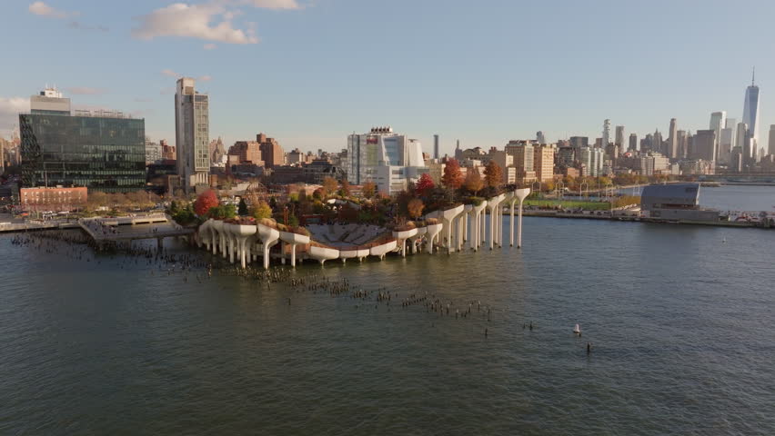 Little Island artificial park in Hudson River in Meatpacking District, Chelsea neighborhoods of Manhattan, New York City, during sunny autumn day