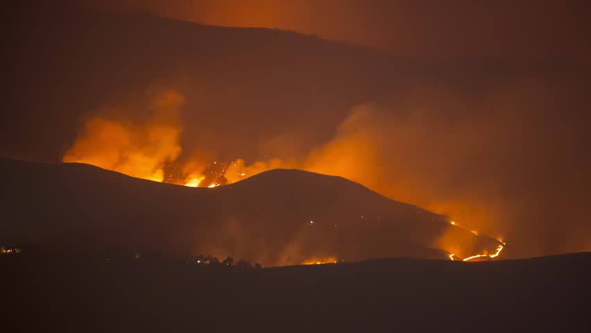 Wildfire at night burning the foothills in Boise Idaho