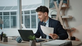 Happy financial manager videocalling by laptop satisfied company profit report closeup. Smiling executive manager talking at online meeting in office. Cheerful ceo discussing success at web conference - Powered by Shutterstock - Get 15% off with code: PIKWIZARD15