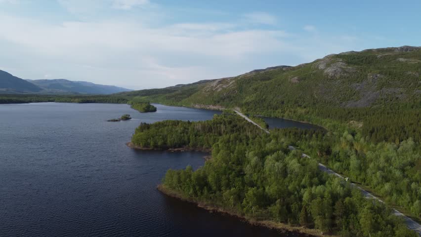 drone aerial view of isolated asphalted road in sweden countryside Scandinavia
