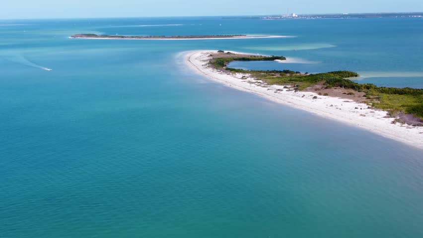 Honeymoon Island State Park, Florida. Aerial view of turquoise waters, white sand beaches, and lush nature. Perfect for a tropical getaway on the Gulf of Mexico.