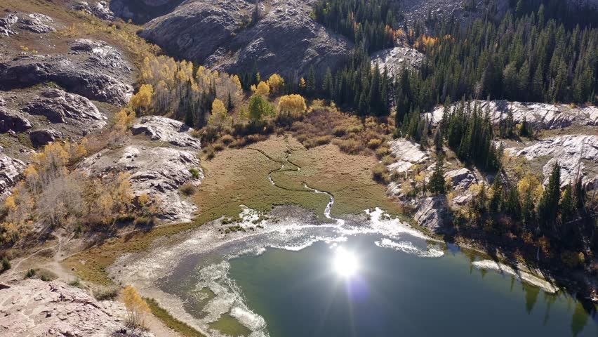 Aerial drone shot of Lake Blanche in Utah’s Big Cottonwood Canyon. Rotating bird