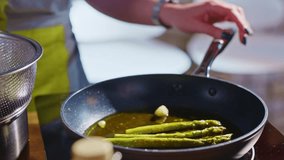 Real authentic cooking in kitchen - aspargus in frying pan - Powered by Shutterstock - Get 15% off with code: PIKWIZARD15