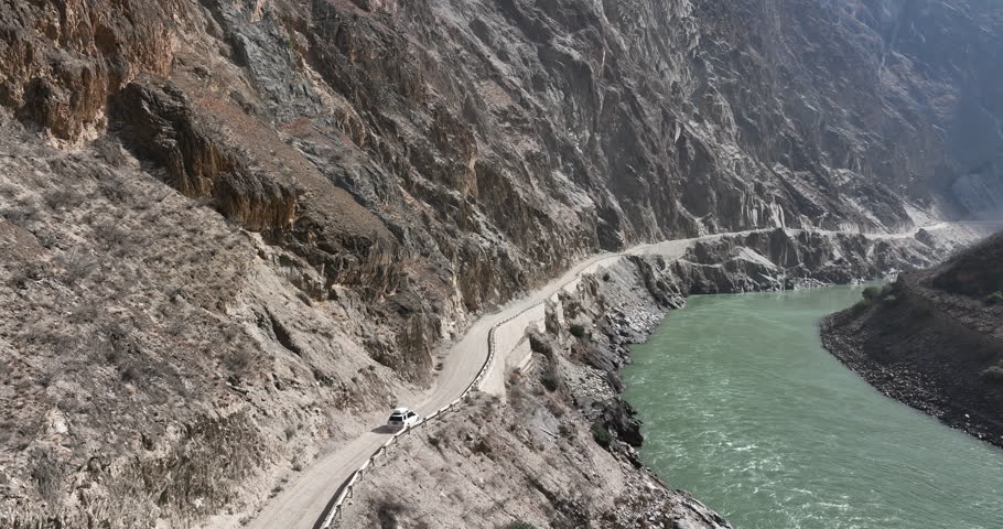 Aerial footage of driving off road car in tibet, China