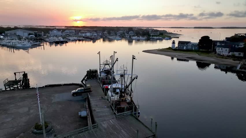 aerial push over fishing boats in hyannis port massachusetts