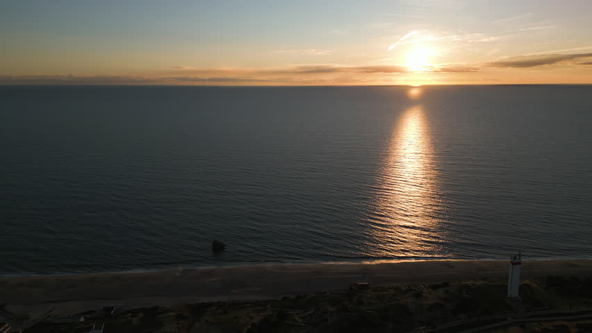 Beautiful orange sunset over seascape of Spain, aerial view