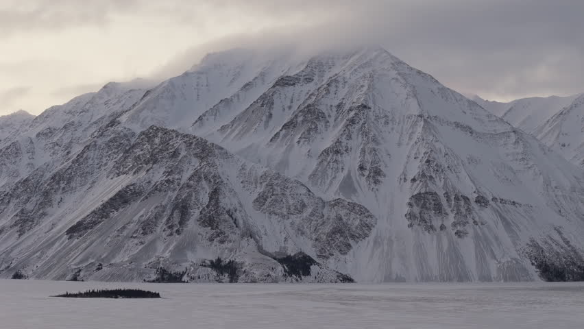 Steep Rock Mountains On Kathleen Lake During Winter In Yukon, Canada. Wide Shot