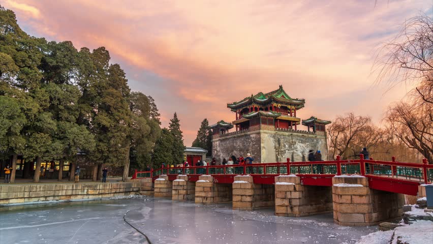 Beijing, China - December 25th 2023 - Tourists enjoying the beautiful dusk near Beijing Summer Palace Wenchang Tower (