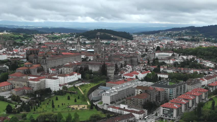Santiago de Compostela, historic Cathedral and City of Culture of Galicia in background, cityscape, Spain. Aerial drone panoramic view