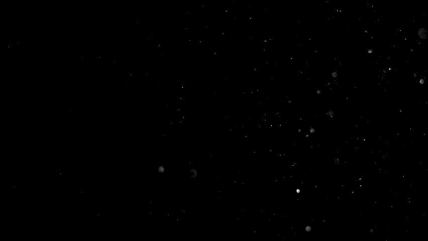 Real Slow Motion Dust Particles Floating on Dark Black Background. Use Add Screen Mode for Compositing Asset VFX to Create Your Scene ProRes 4K.