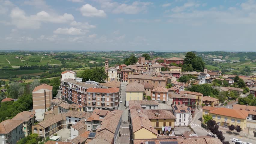 Agliano Terme, Asti, Piedmont, Italy. 4k aerial view of the town. Langhe-Roero and Monferrato. Flying forward above the town.