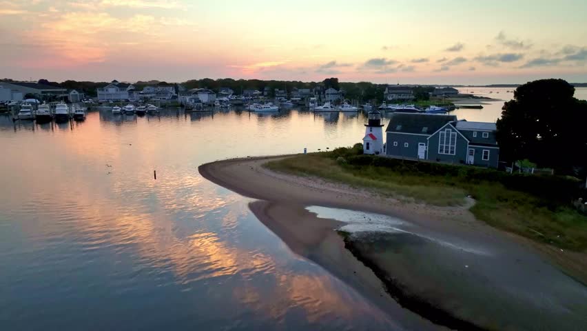 aerial at sunrise pushing in over the harbor at hyannisport, hyannis port massachusetts
