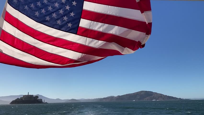American flag on a boat, flapping in the wind on the way to the prison island Alcatraz