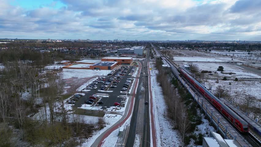 Train Passing Through village trainstatin. Unique aerial view flight drone