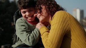 Happy disabled child and mother sharing a loving moment outdoors - Powered by Shutterstock - Get 15% off with code: PIKWIZARD15