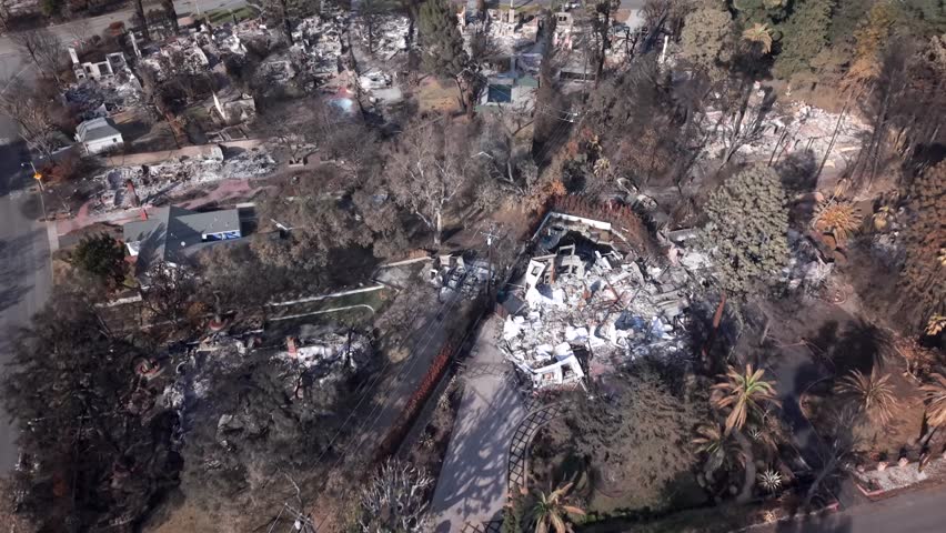 Aerial of Destructive Eaton Wildfire area over Neighborhood of Altadena with almost all homes burnt to the ground