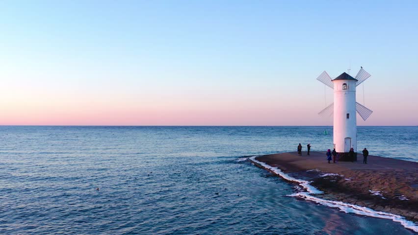 romantic sunset light on the frozen beach near the pier of Swinemünde Baltic Sea