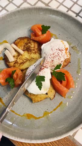 Poached egg on toast bread with red egg and vegetables with spices and herbs