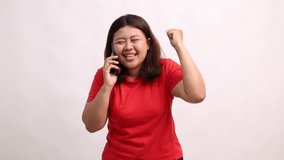Young woman celebrates a phone call, expressing joy and success. - Powered by Shutterstock - Get 15% off with code: PIKWIZARD15