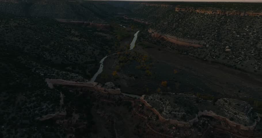 Mills canyon in new mexico during sunset with serene river landscape, aerial view