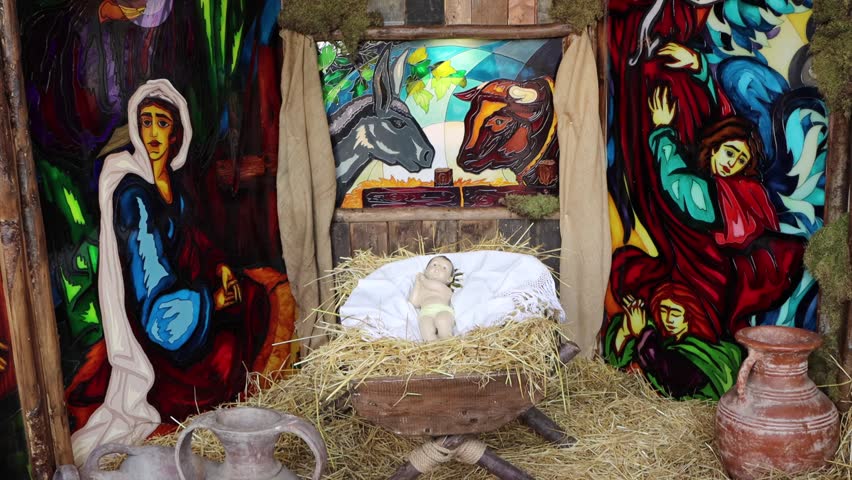 a beautiful handmade nativity with lights and figures of shepherds, joseph, jesus and mary. The baby Jesus is amazing