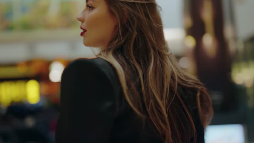 A confident woman with red lipstick in a busy urban setting, exuding elegance and sophistication. Perfect for concepts of urban lifestyle, beauty, and modern living. Confident Woman with Red Lipstick