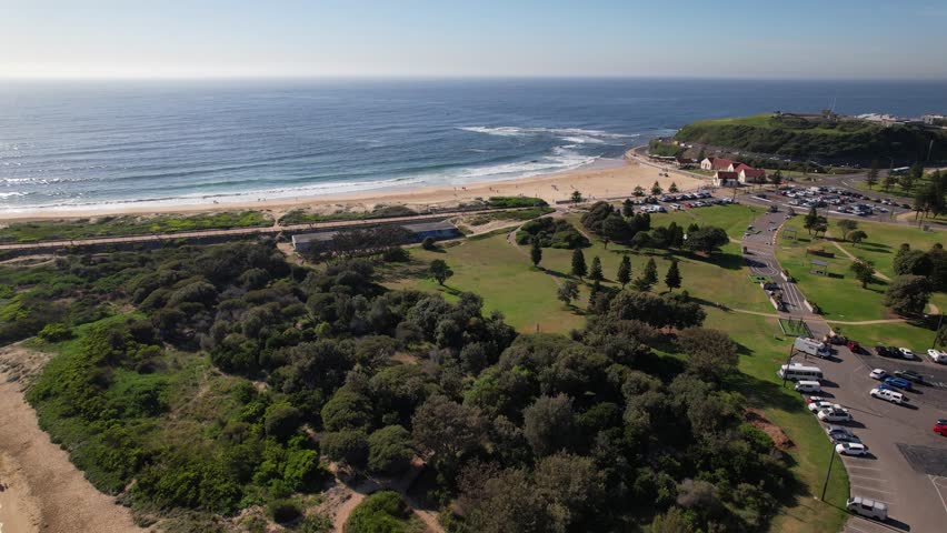 Tranquil Horseshoe Beach And Nobbys Beach In New South Wales, Australia - Aerial Pullback