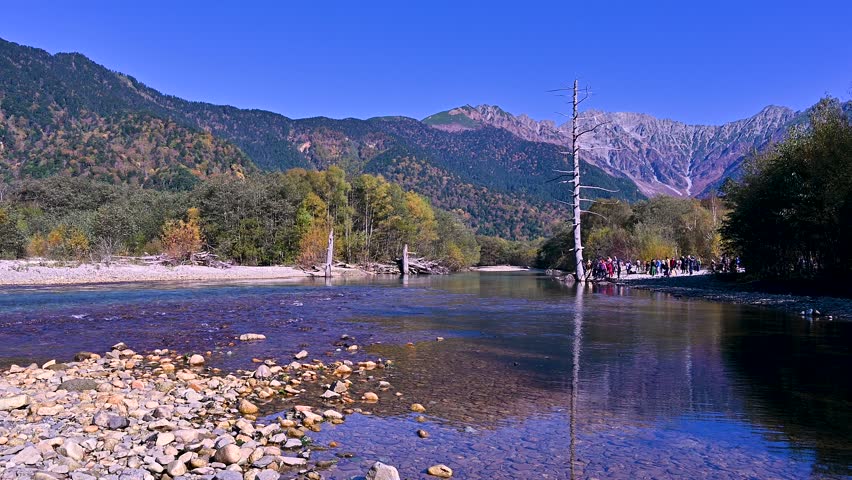 Autumn season of Kamikochi, Chubu-Sangaku National Park,  Japan  Beautiful mountain, Nature landscape at Kamikochi Japan in the Northern Japan Alps with pond and mountain, Matsumoto, Nagano, Japan