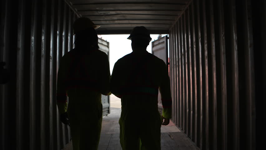 Engineers and technicians inspect the inside of containers and order repairs at the container manufacturing and storage site