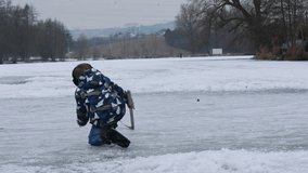 Happy child, boy, casually dressed, skating on a frozen lake during the day, beautiful sunset in the forest behind, having fun - Powered by Shutterstock - Get 15% off with code: PIKWIZARD15