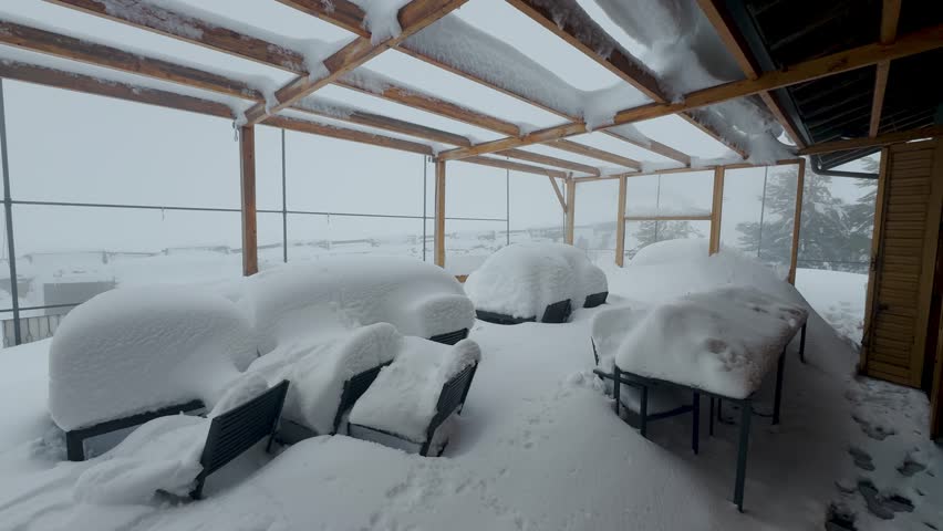 Rifugio Sapienza Etna Sud tourist area on the Etna volcano in winter. Ski resorts in Sicily. Etna South with sea view. Snow on Etna. Silvestri craters covered in snow. Shops and restaurants.