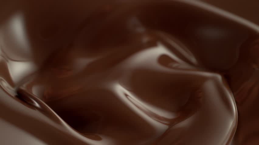 Super Slow Motion of Splashing and Mixing Hot Melted Chocolate, Creating Waves Shapes, Filmed on High Speed Cinema Camera, 1000 fps.
