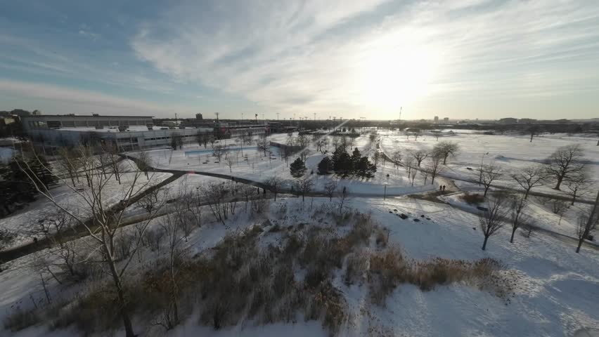 Jarry Park Covered With Snow During Winter In Montreal, Quebec, Canada. - aerial FPV shot